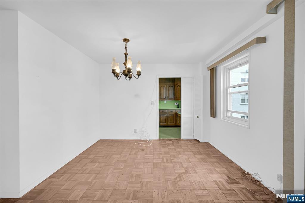 280 Prospect Avenue, Unit 3N Hackensack, NJ 07601 - Photo 12 of 23 a view of a bedroom with a window and chandelier fan