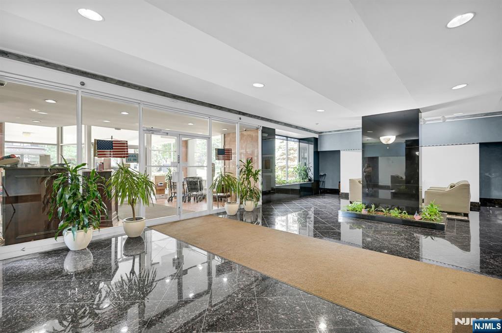 280 Prospect Avenue, Unit 3N Hackensack, NJ 07601 - Photo 5 of 23 a living room with furniture a large window and wooden floor