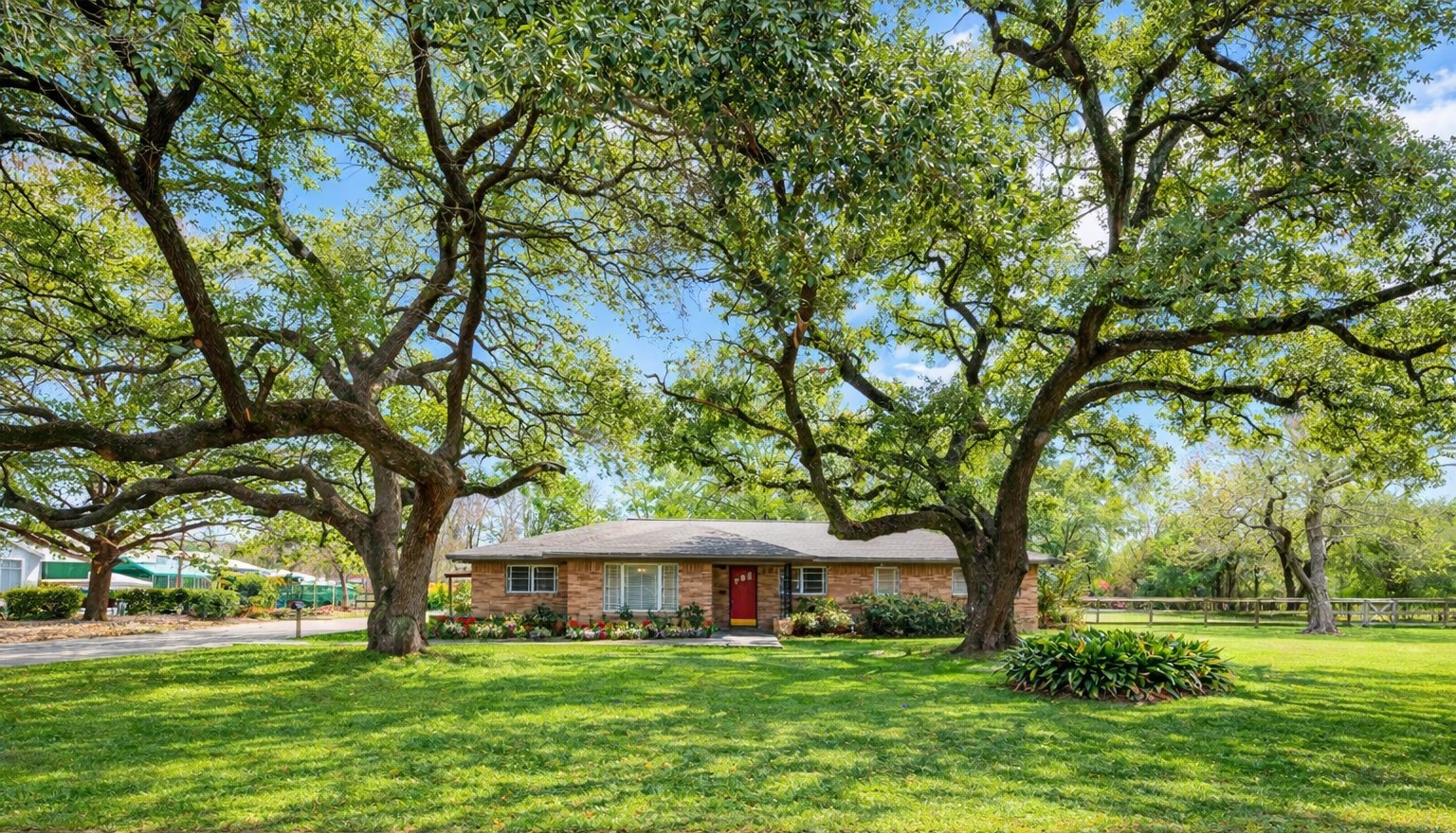 In-city property spanning nearly two acres with mature trees, including stately oaks, offering rare space and privacy near downtown Houston.