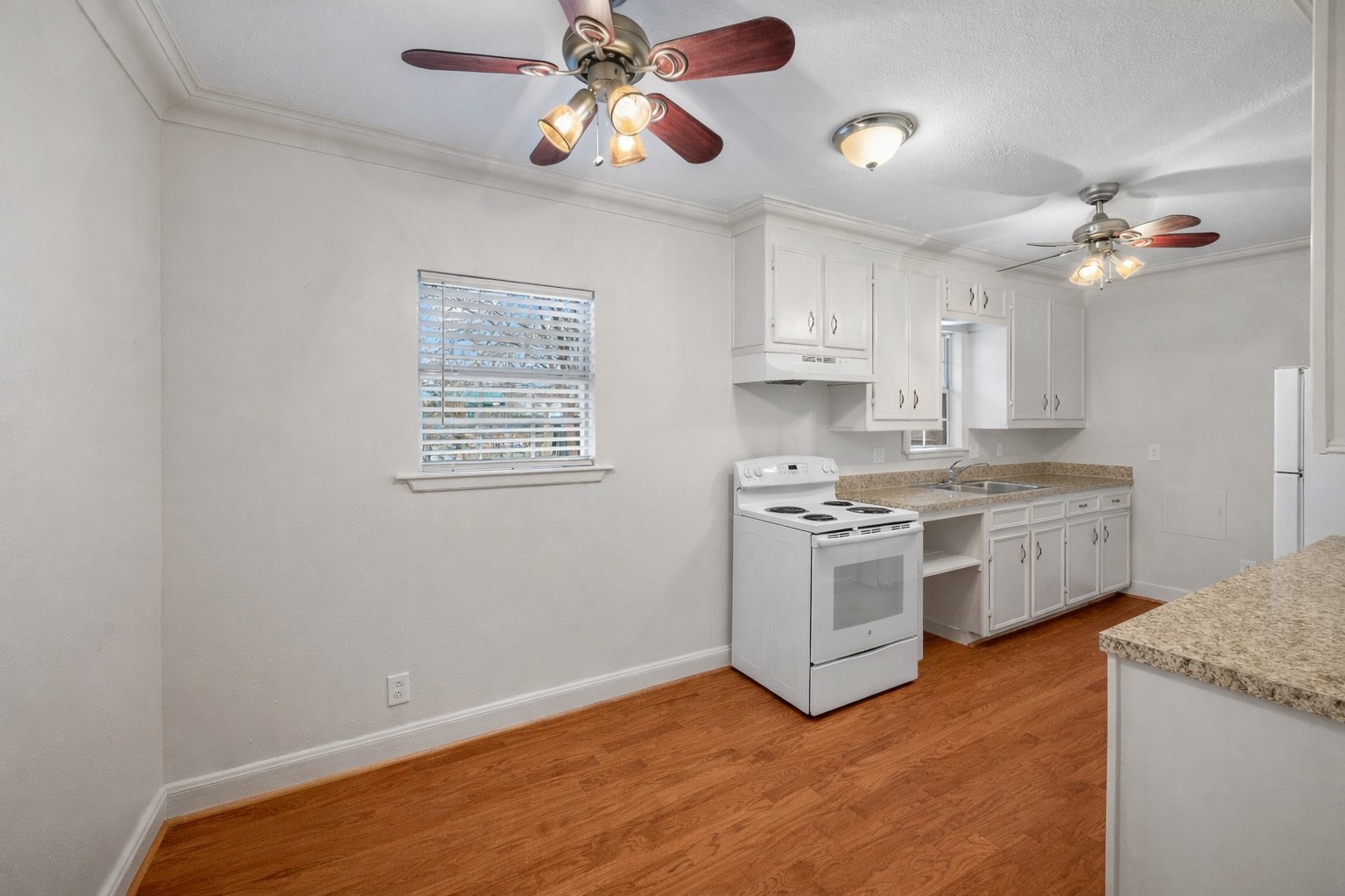 405 Hohldale Street Houston, TX 77091 - Photo 23 of 39 The garage apartment features a full size kitchen with ample space for food preparation. Ceiling fans and abundant lighting provide additional illumination and ventilation.