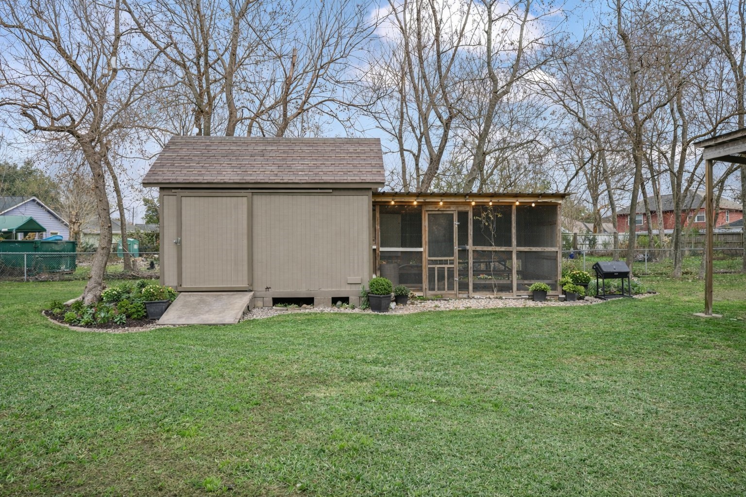 405 Hohldale Street Houston, TX 77091 - Photo 30 of 39 A quaint chicken coop set within the property grounds, ideal for sustainable or hobby farming. Photo enhanced to show potential.