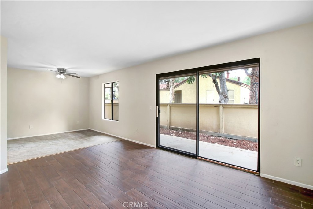 1110 West Blaine Street, Unit 107 Riverside, CA 92507 - Photo 9 of 48 Living Room and Exit to Patio