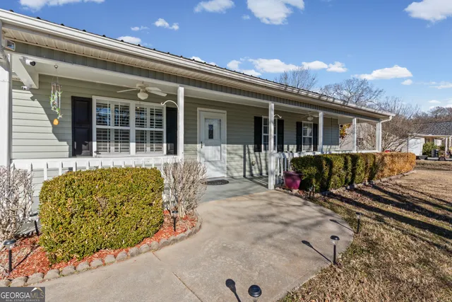 front view of a house with a patio