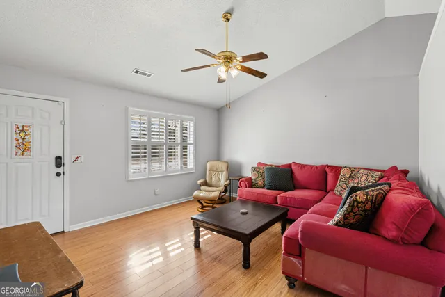 a living room with furniture and a window