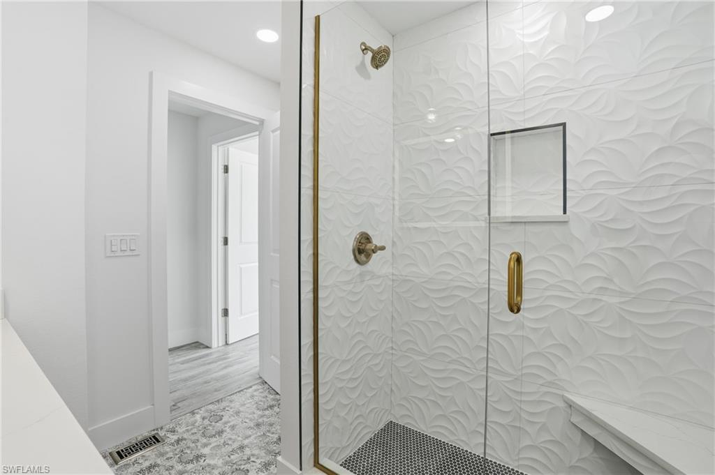 270 Dundee Road Fort Myers Beach, FL 33931 - Photo 31 of 48 Full bath featuring tiled shower and recessed lighting - Virtually Edited Image