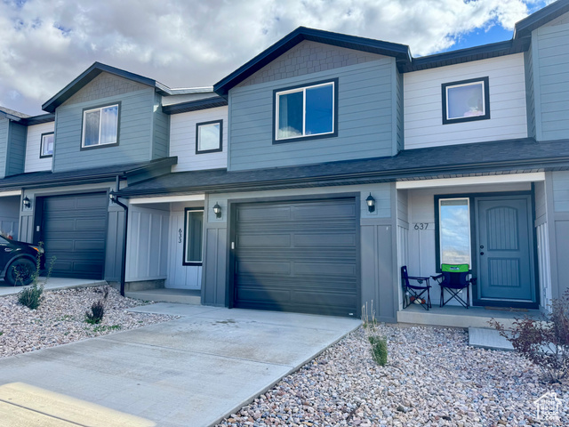 633 West 880th Street South Fillmore, UT 84631 - Photo 1 of 1 View of front of home featuring concrete driveway, board and batten siding, and roof with shingles