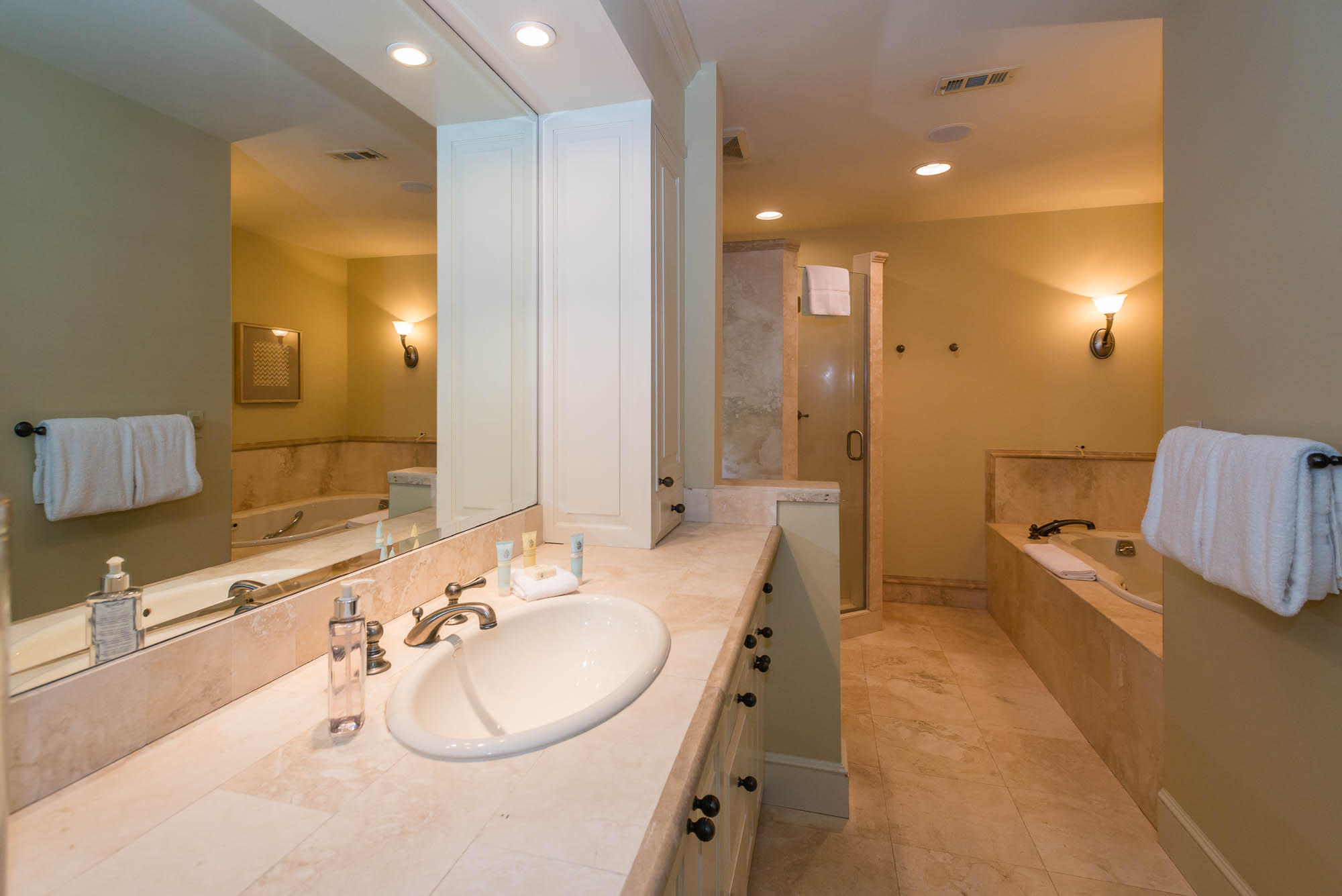 279 Grayton Trail Road Santa Rosa Beach, FL 32459 - Photo 19 of 55 a bathroom with a double vanity sink tub and mirror