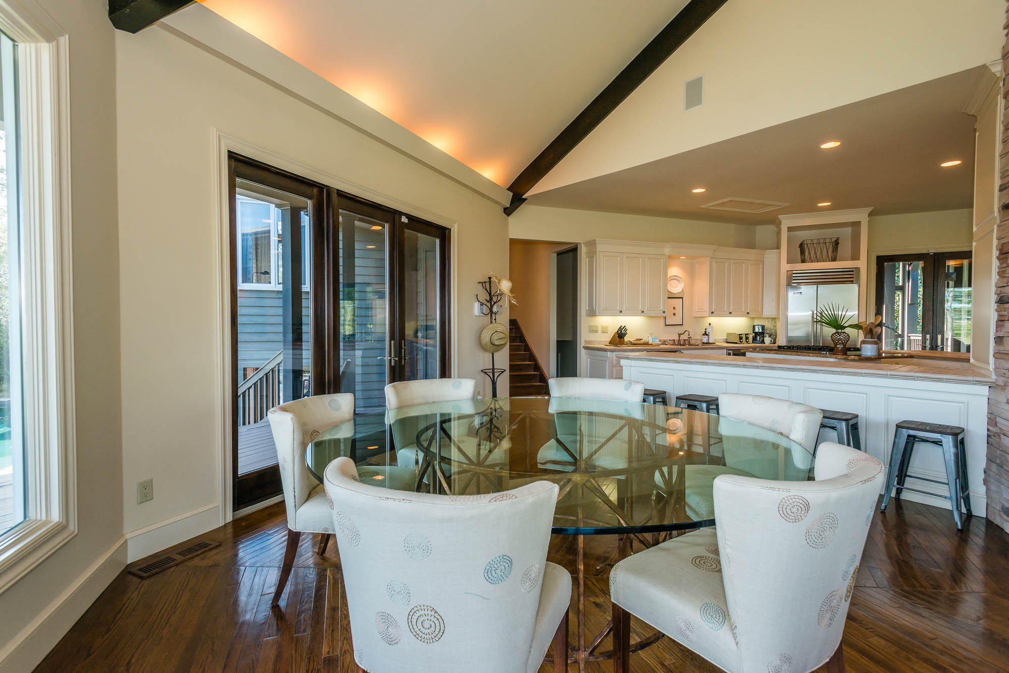 279 Grayton Trail Road Santa Rosa Beach, FL 32459 - Photo 6 of 55 a view of a dining room with furniture wooden floor and a chandelier
