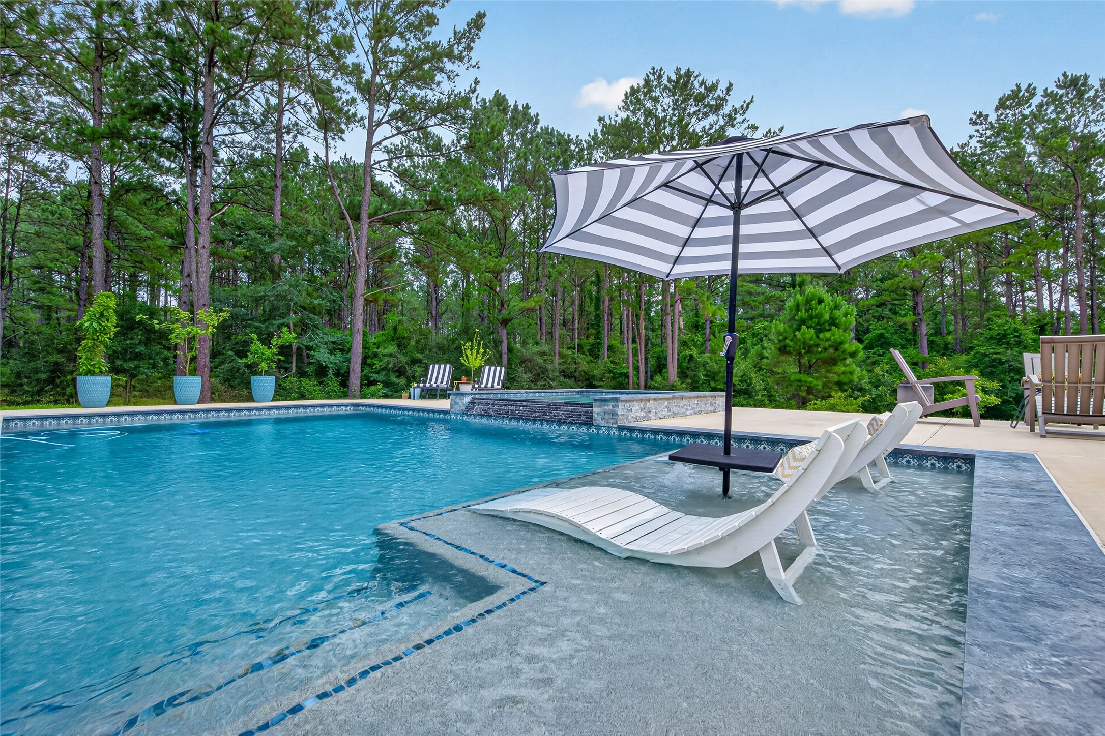10915 Ruger Road Willis, TX 77378 - Photo 42 of 50 Escape to your private oasis with this stunning pool and spa, offering a daily retreat at home.
