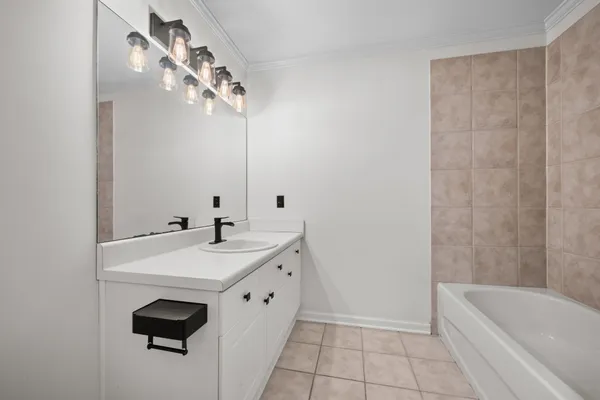 a bathroom with a sink a vanity and a mirror