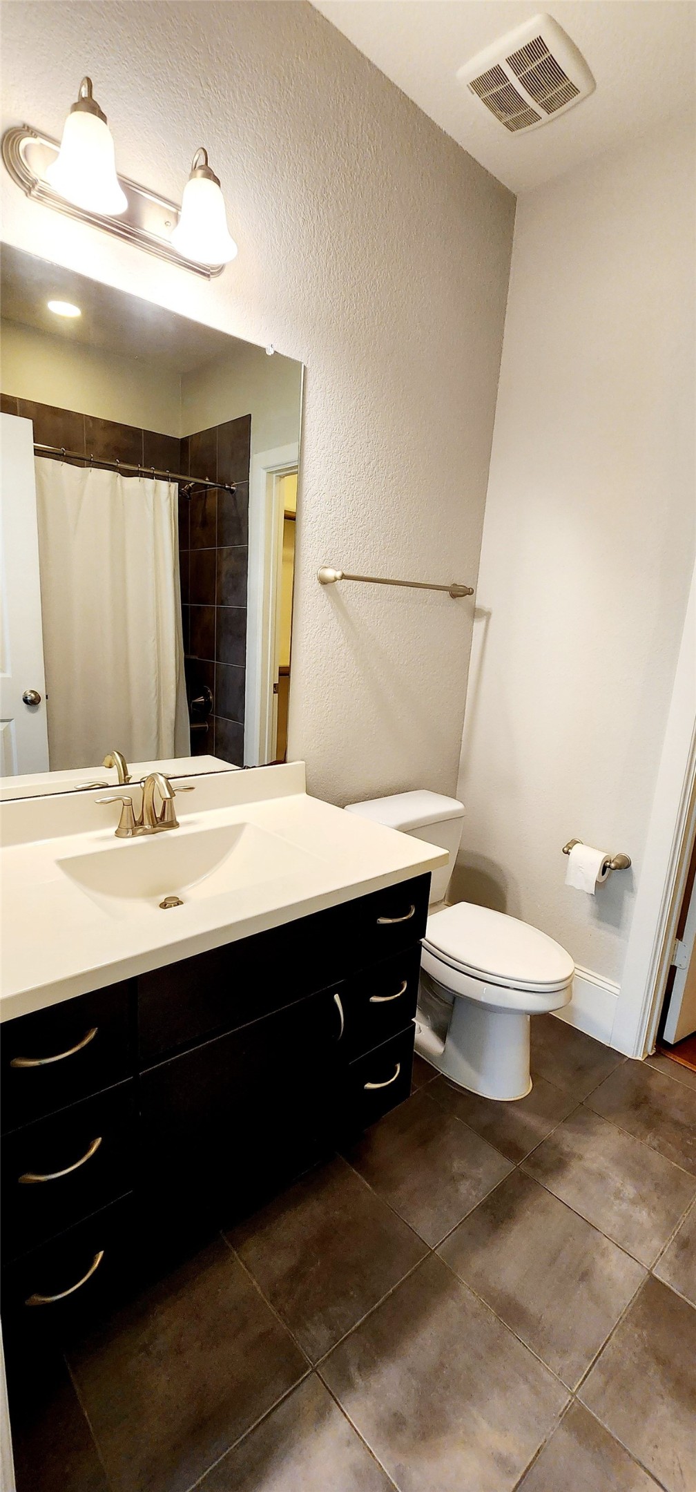 11 West Rafters Row The Woodlands, TX 77380 - Photo 5 of 31 a bathroom with a sink vanity mirror and toilet