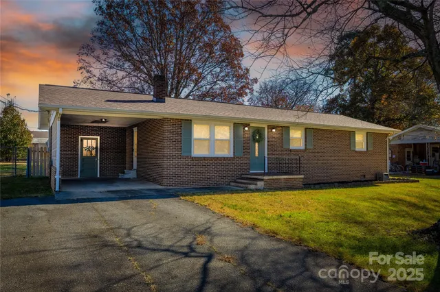 a view of a house with pool yard and front view of house