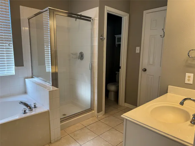 a bathroom with a tub and sink