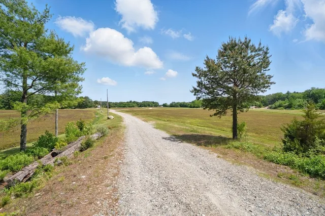 a view of a lake with a big yard