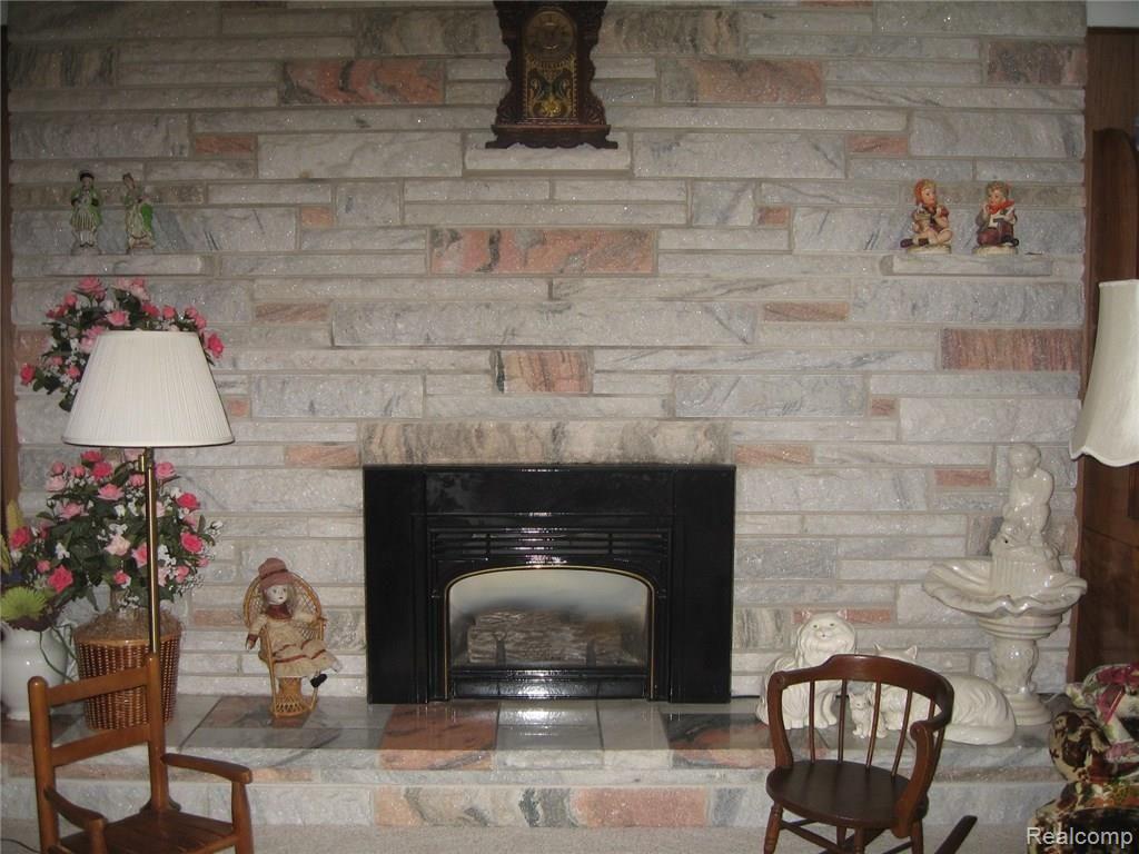 9025 East Potter Road Davison, MI 48423 - Photo 12 of 39 Gas fireplace with Georgia marble
