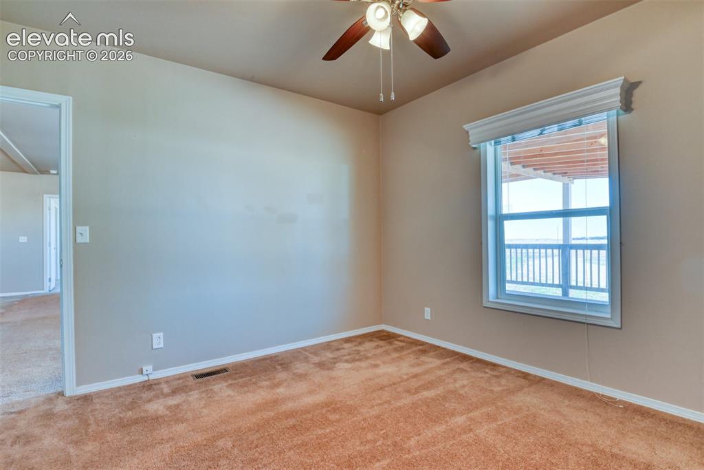 22558 Enoch Road Calhan, CO 80808 - Photo 16 of 50 an empty room with a window