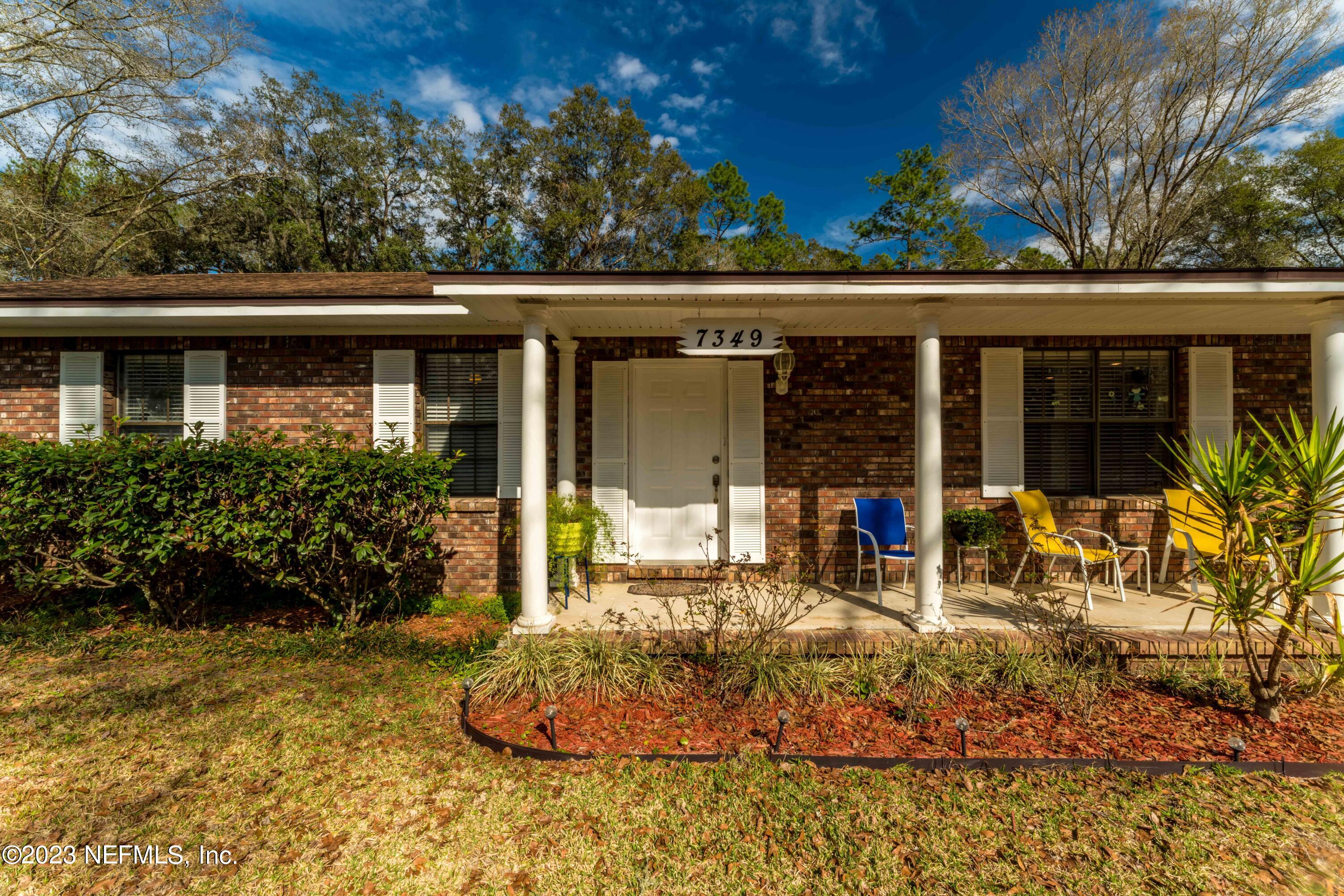 7349 Oakridge Loop Glen St. Mary, FL 32040 - Photo 12 of 56 a front view of a house with a porch