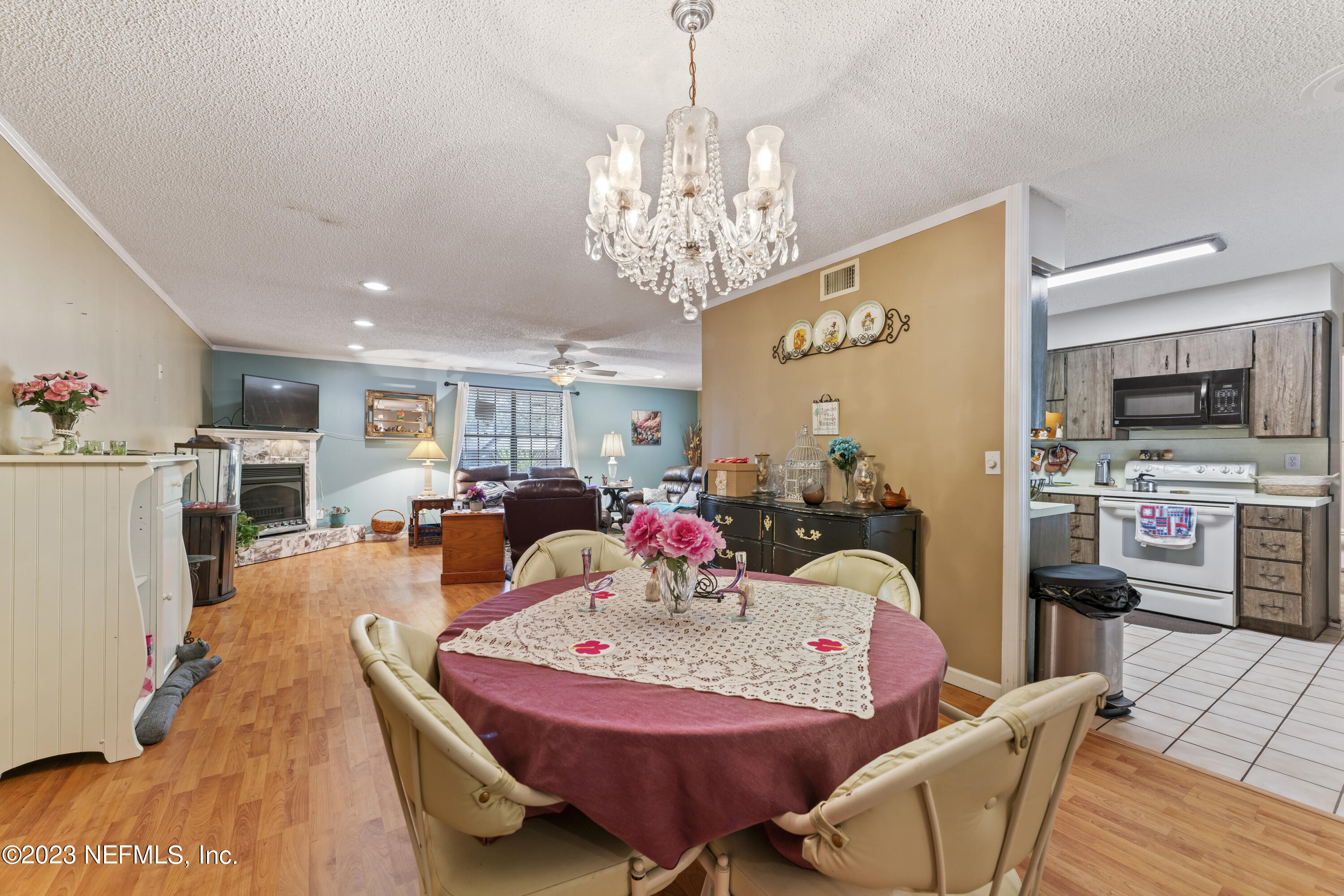 7349 Oakridge Loop Glen St. Mary, FL 32040 - Photo 18 of 56 a view of a dining room with furniture and a chandelier