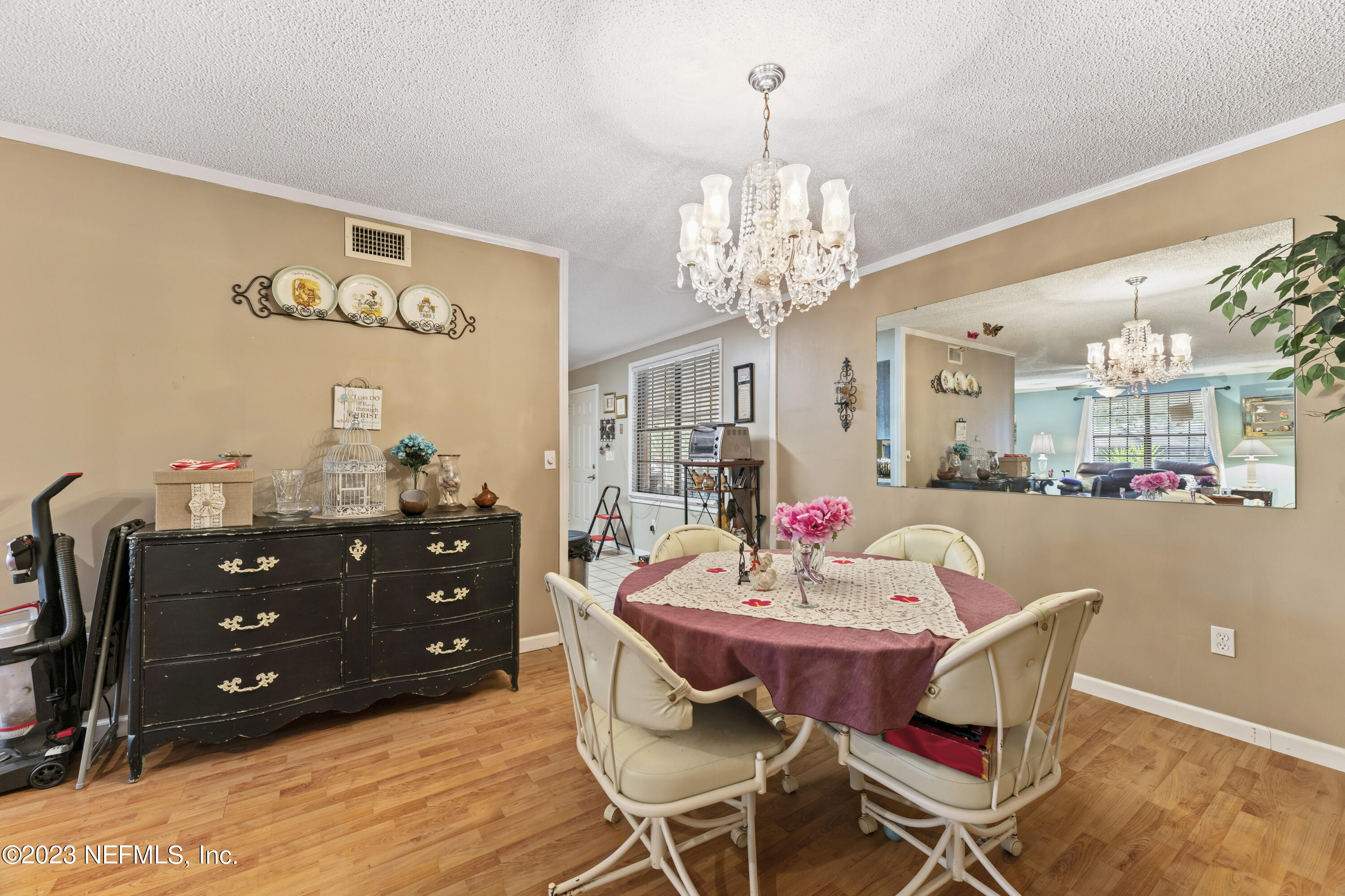 7349 Oakridge Loop Glen St. Mary, FL 32040 - Photo 19 of 56 a view of a dining room with furniture and chandelier