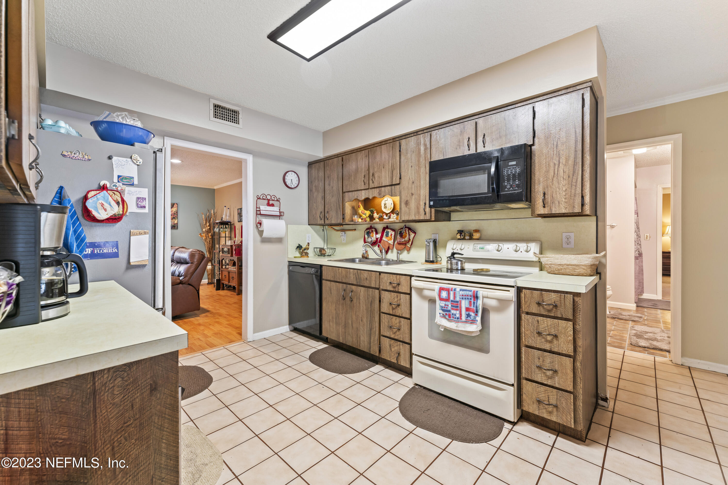 7349 Oakridge Loop Glen St. Mary, FL 32040 - Photo 20 of 56 a kitchen with a stove top oven and cabinets