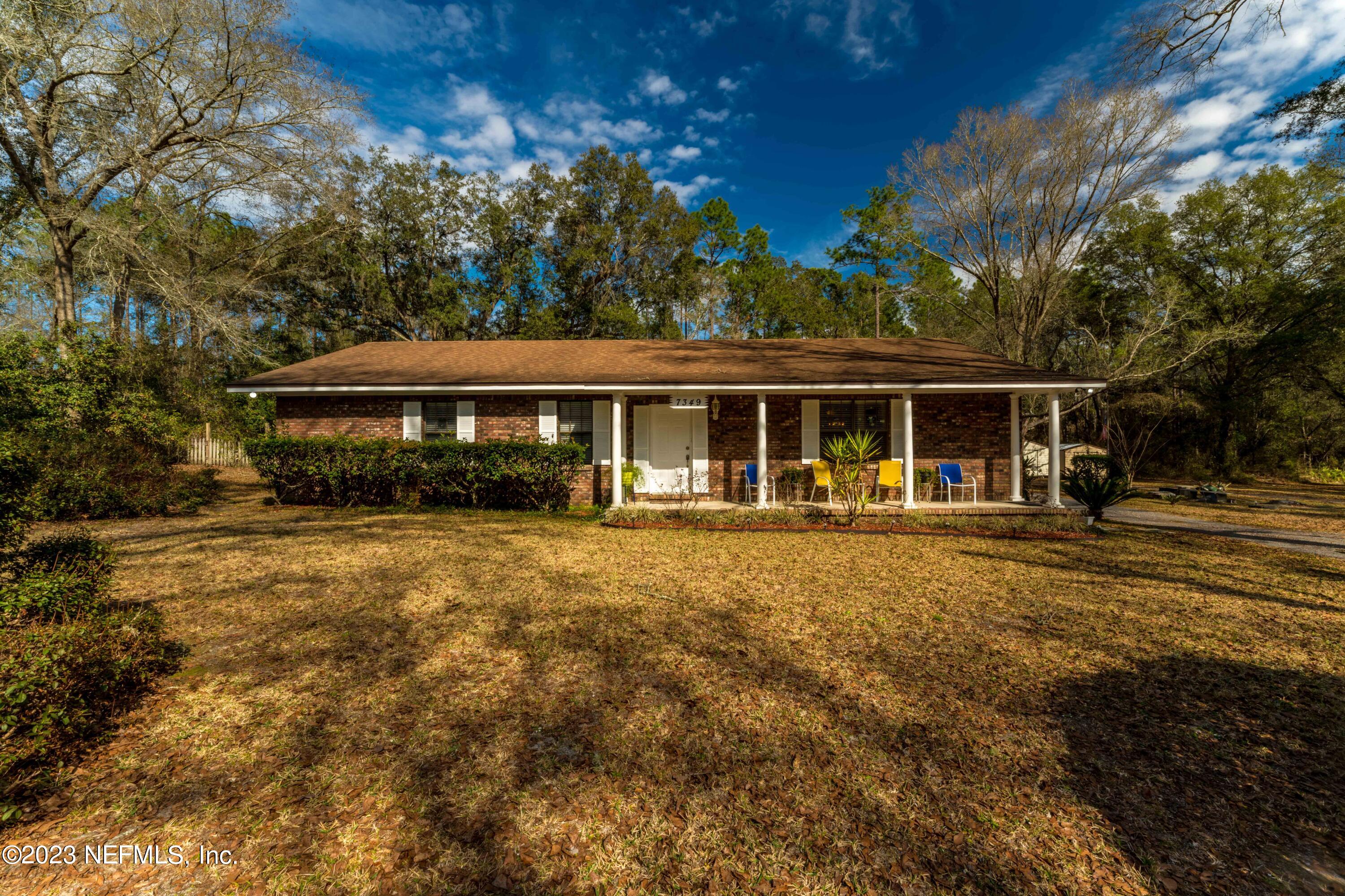 7349 Oakridge Loop Glen St. Mary, FL 32040 - Photo 2 of 56 a view of a house with a yard
