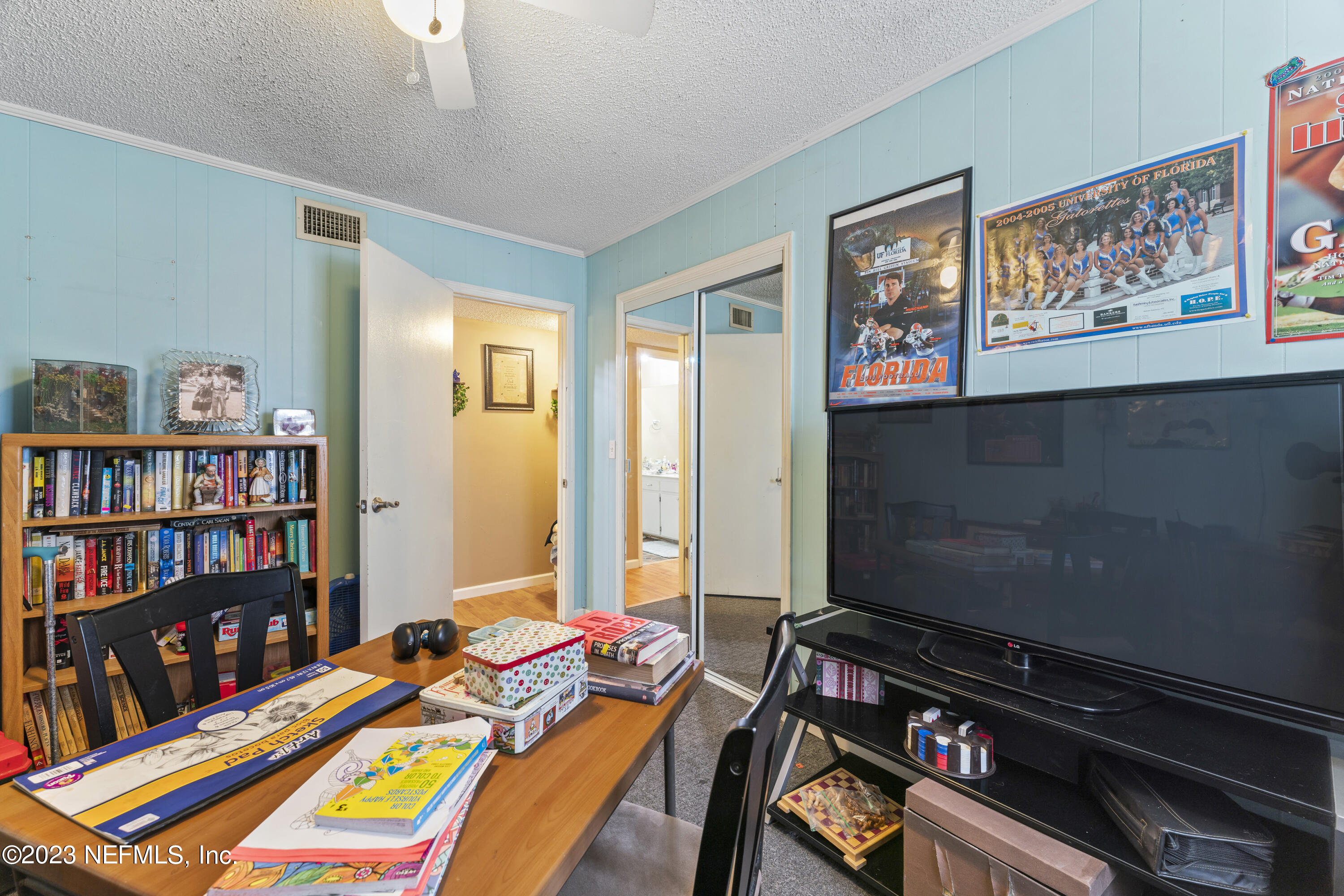 7349 Oakridge Loop Glen St. Mary, FL 32040 - Photo 28 of 56 a bedroom with furniture and a book shelf