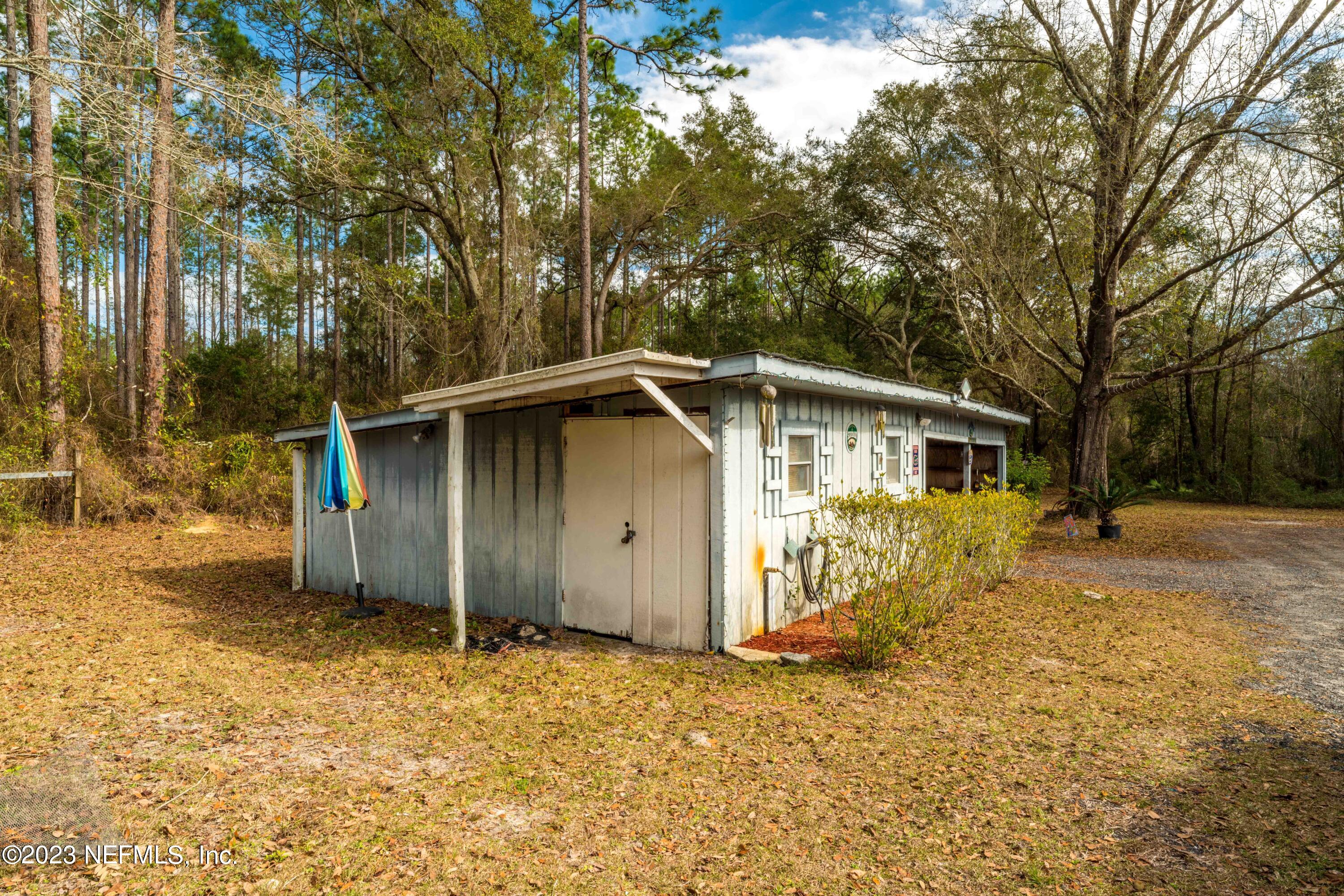 7349 Oakridge Loop Glen St. Mary, FL 32040 - Photo 38 of 56 a view of a house with a yard