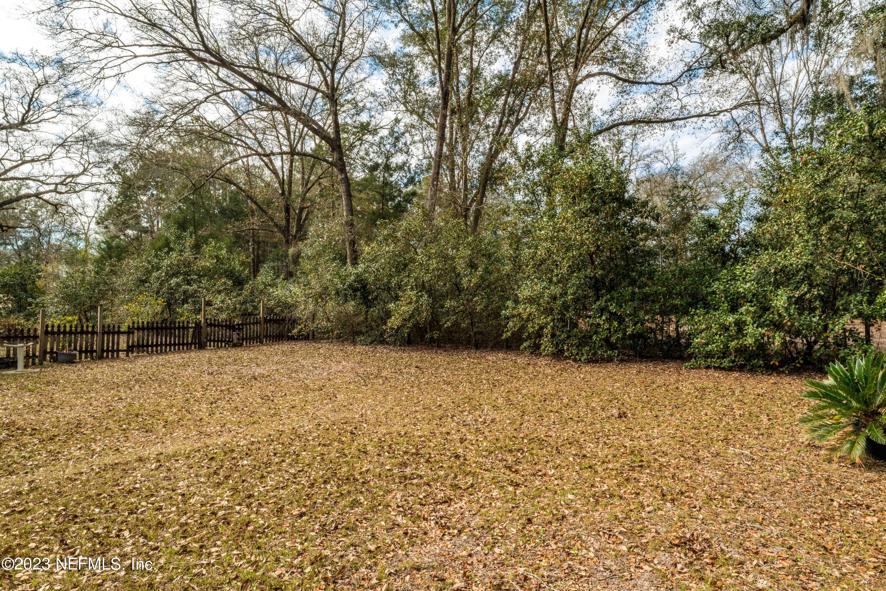 7349 Oakridge Loop Glen St. Mary, FL 32040 - Photo 39 of 56 a view of empty room with wooden fence
