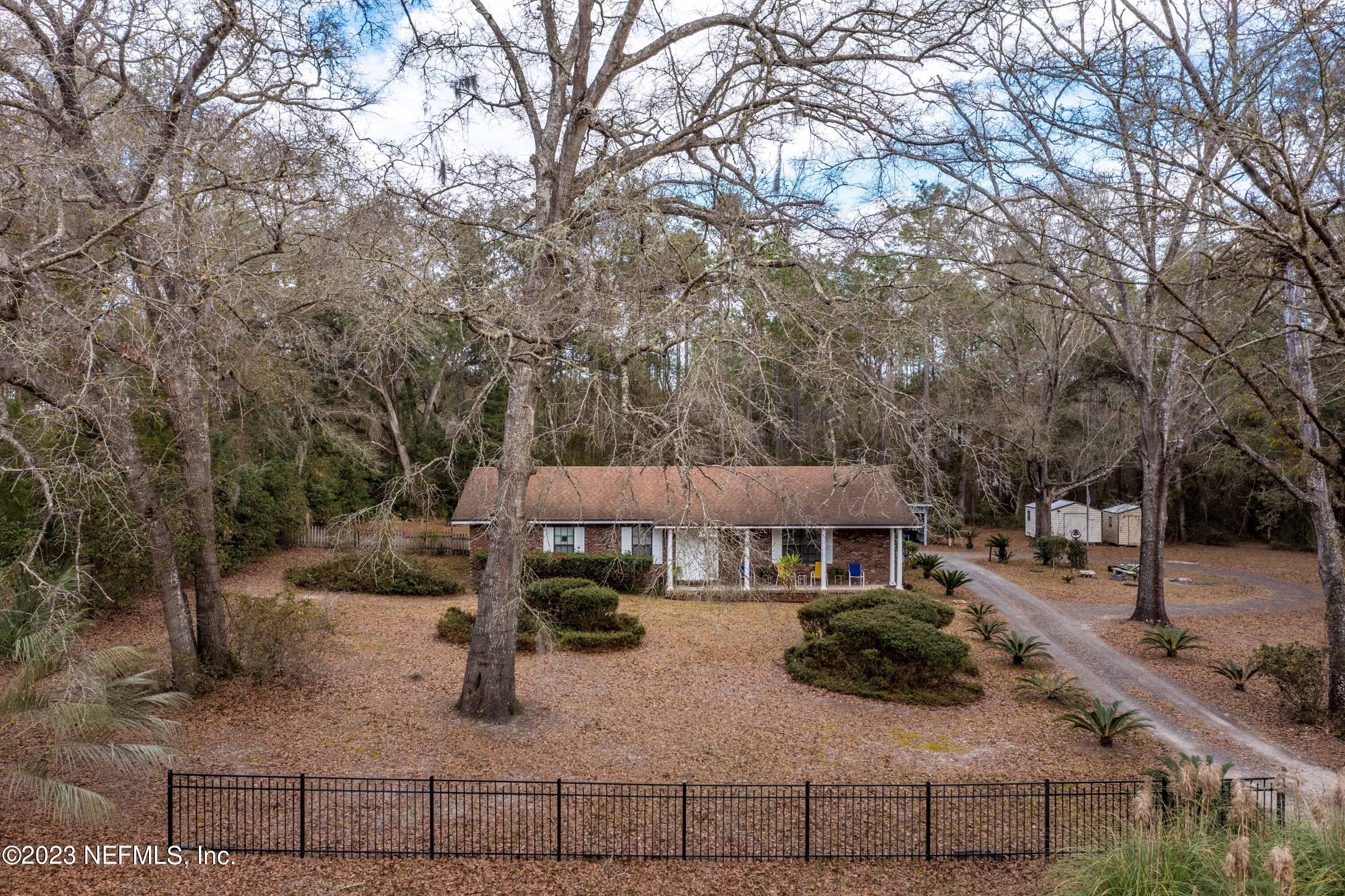 7349 Oakridge Loop Glen St. Mary, FL 32040 - Photo 4 of 56 a view of multiple houses with yard