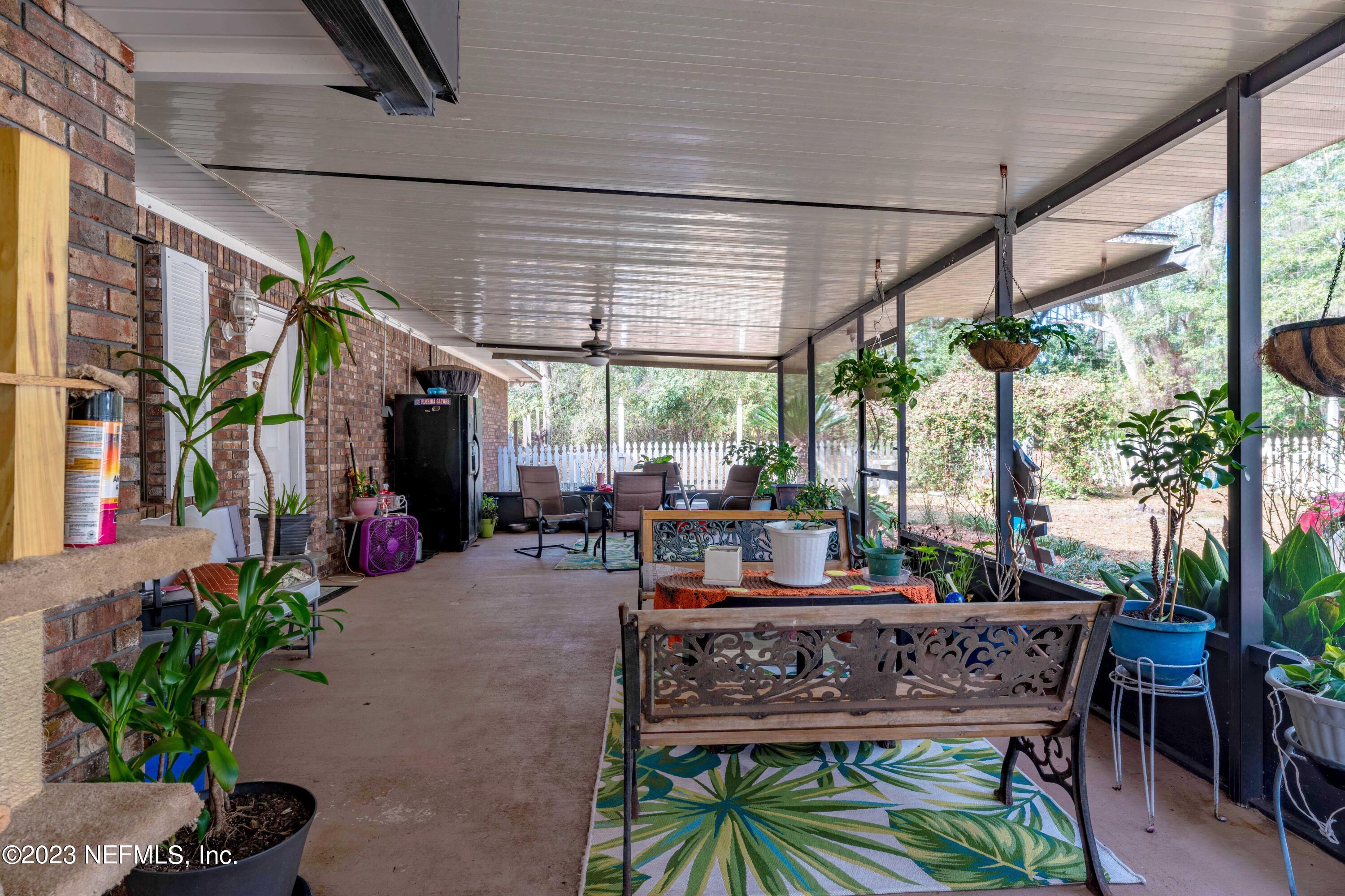 7349 Oakridge Loop Glen St. Mary, FL 32040 - Photo 42 of 56 a view of outdoor space with chairs and potted plants