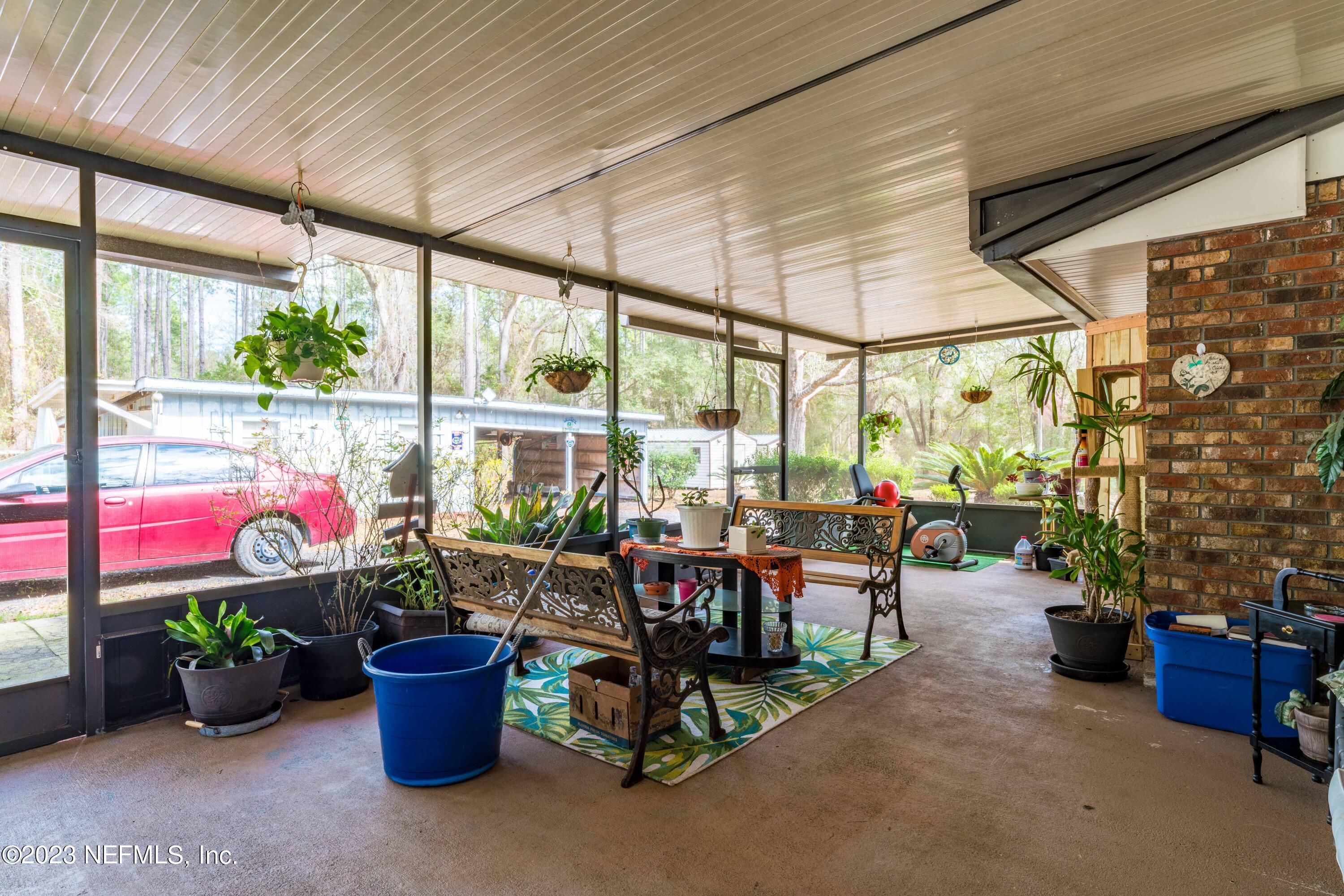 7349 Oakridge Loop Glen St. Mary, FL 32040 - Photo 43 of 56 a room with lots of tables and chairs