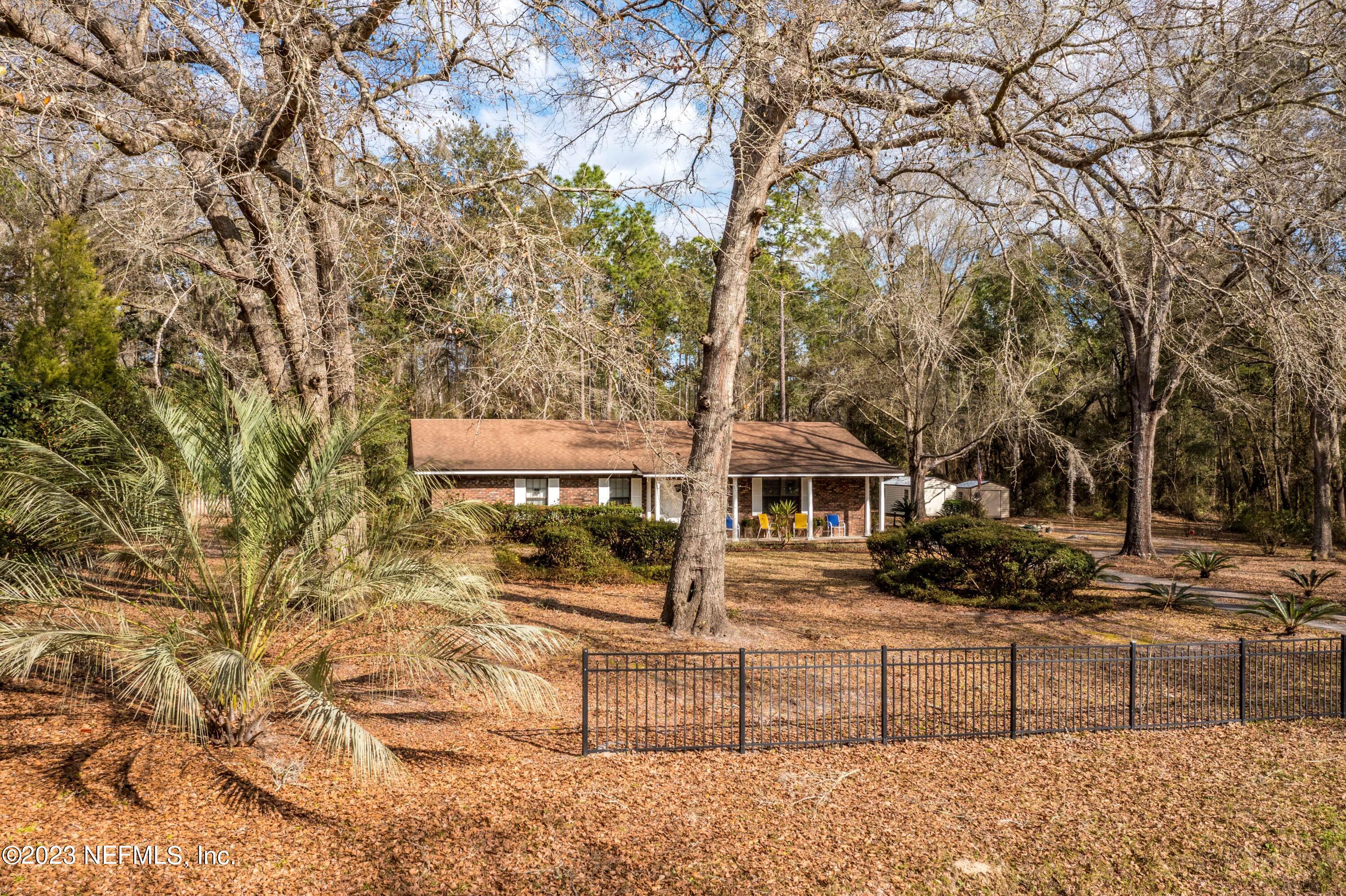 7349 Oakridge Loop Glen St. Mary, FL 32040 - Photo 49 of 56 front view of house with a yard