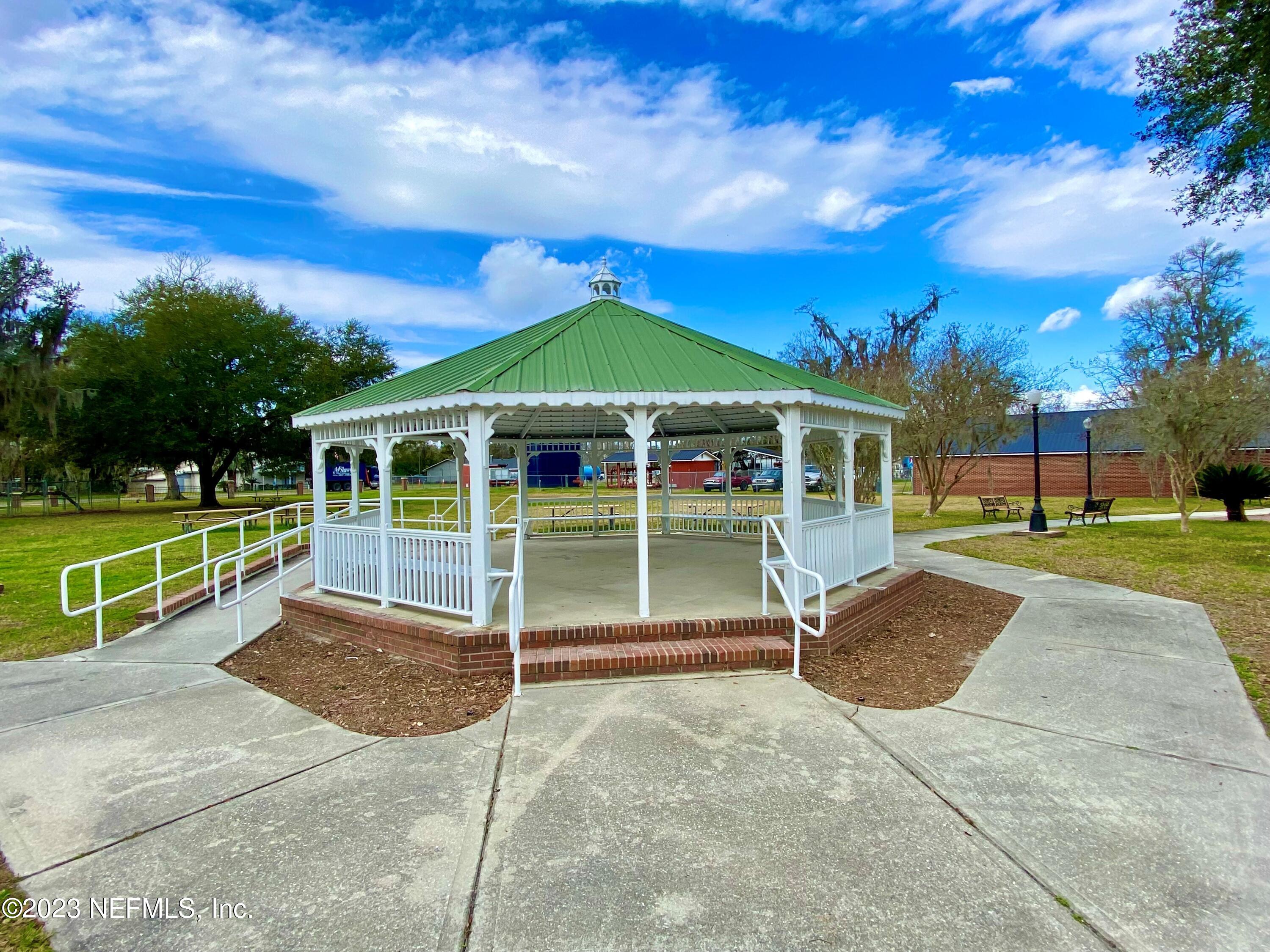 7349 Oakridge Loop Glen St. Mary, FL 32040 - Photo 53 of 56 a view of a house with backyard and porch