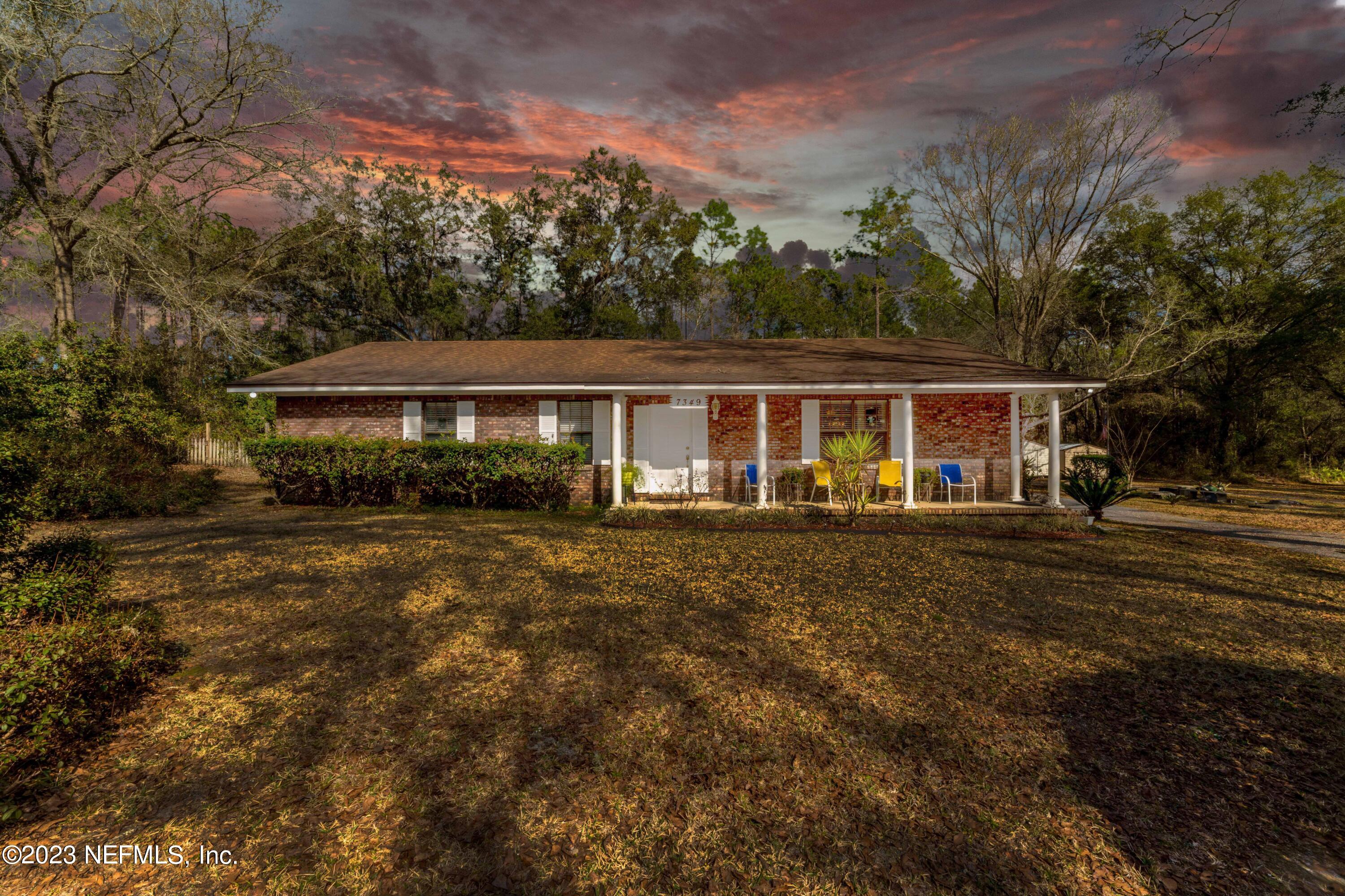 7349 Oakridge Loop Glen St. Mary, FL 32040 - Photo 56 of 56 a front view of a house with a yard