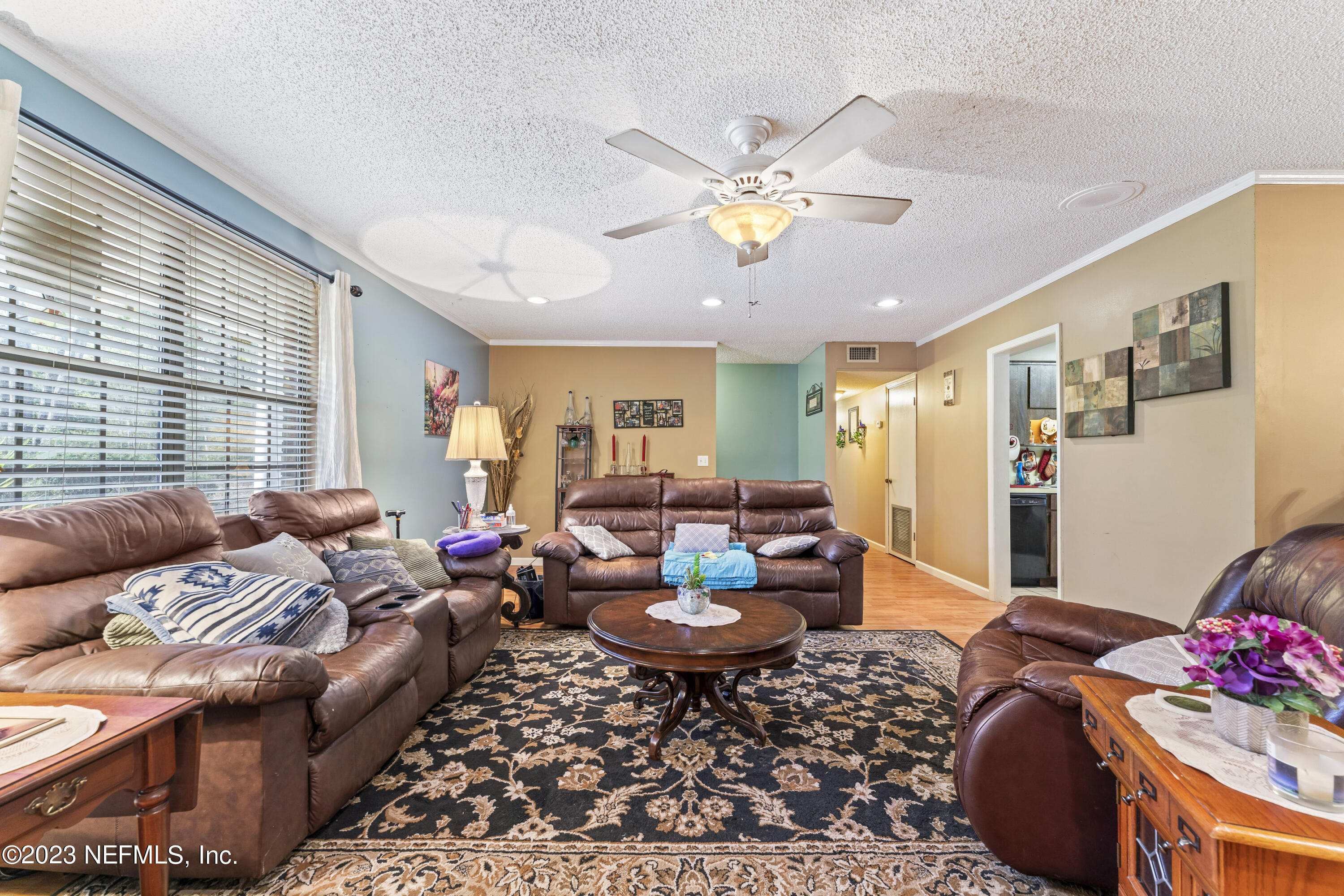 7349 Oakridge Loop Glen St. Mary, FL 32040 - Photo 7 of 56 a living room with furniture and wooden floor