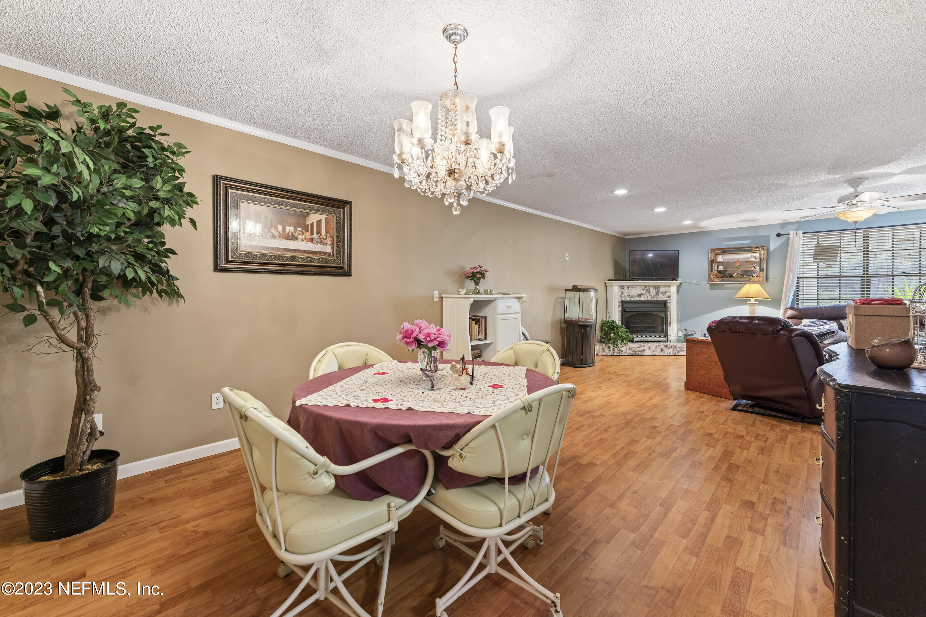7349 Oakridge Loop Glen St. Mary, FL 32040 - Photo 8 of 56 a view of a dining room with furniture and chandelier