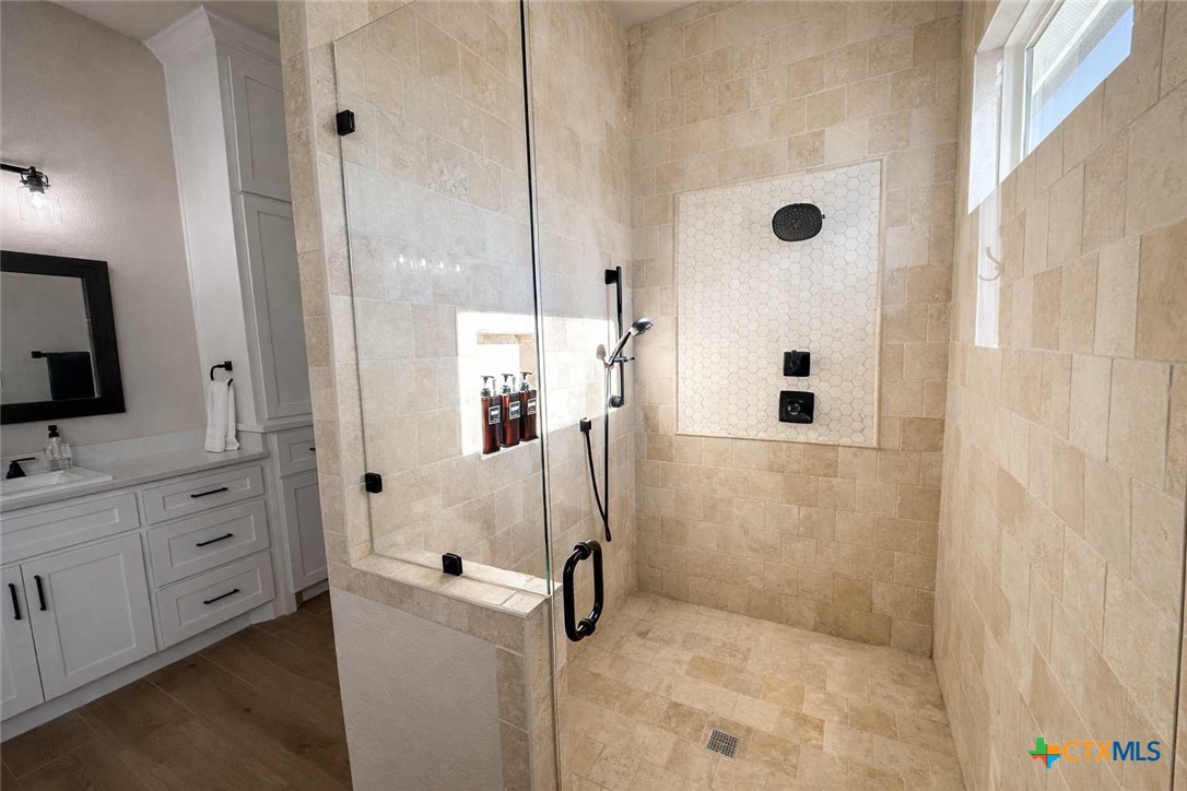 705 Indian Hills Road Gatesville, TX 76528 - Photo 23 of 43 a bathroom with a shower and a sink