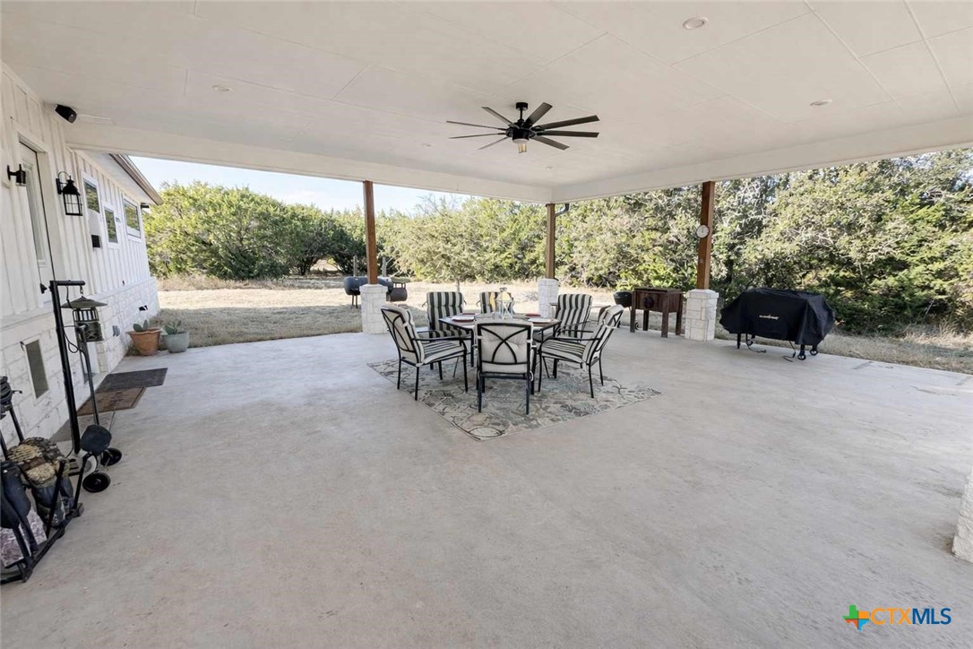 705 Indian Hills Road Gatesville, TX 76528 - Photo 30 of 43 a dining room with furniture and a floor to ceiling window