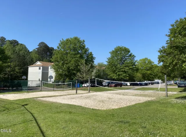 a view of a swimming pool with a yard
