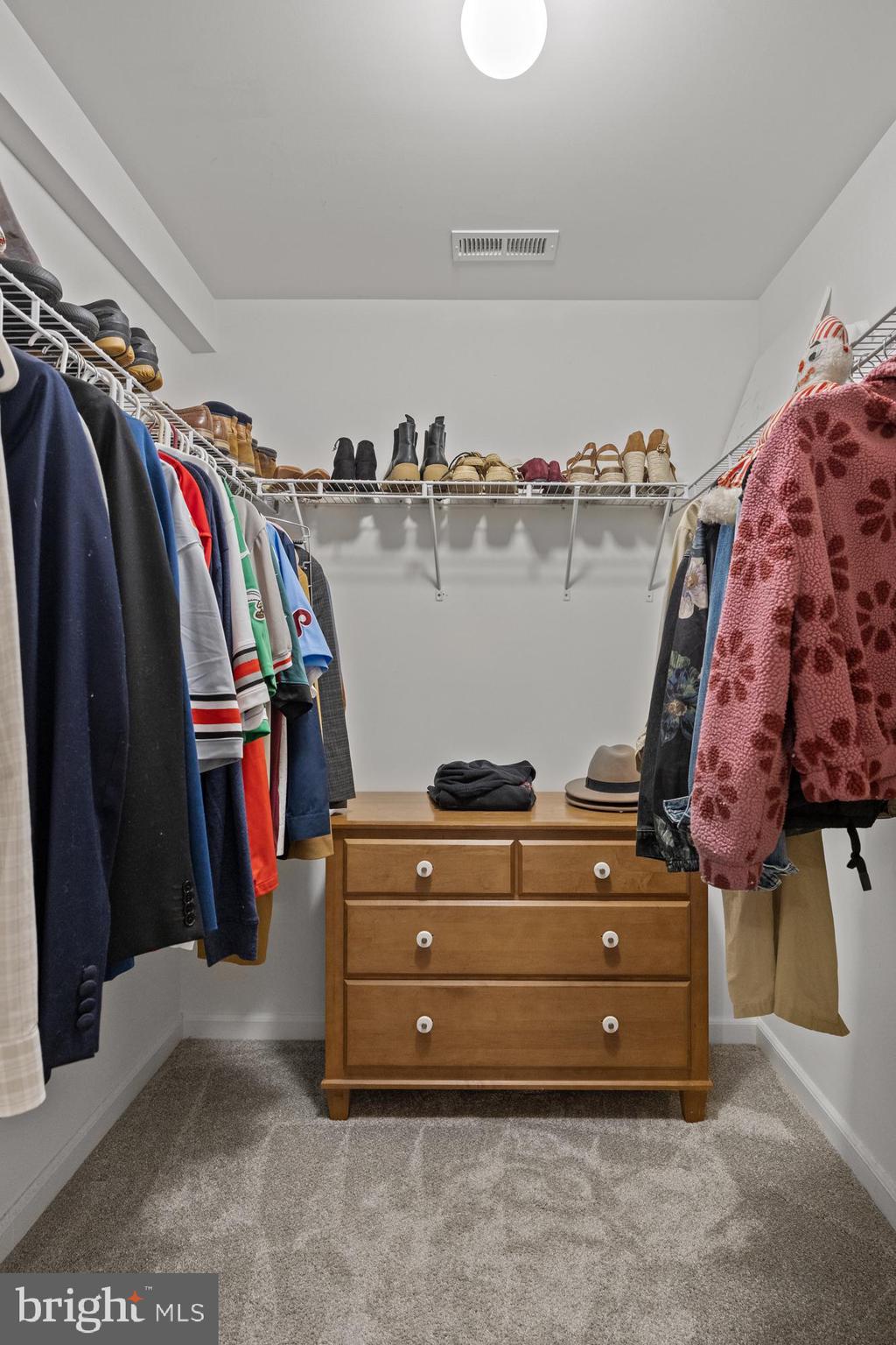 312 Juliustown Road Columbus, NJ 08022 - Photo 25 of 43 a view of walk in closet with clothes and shoes