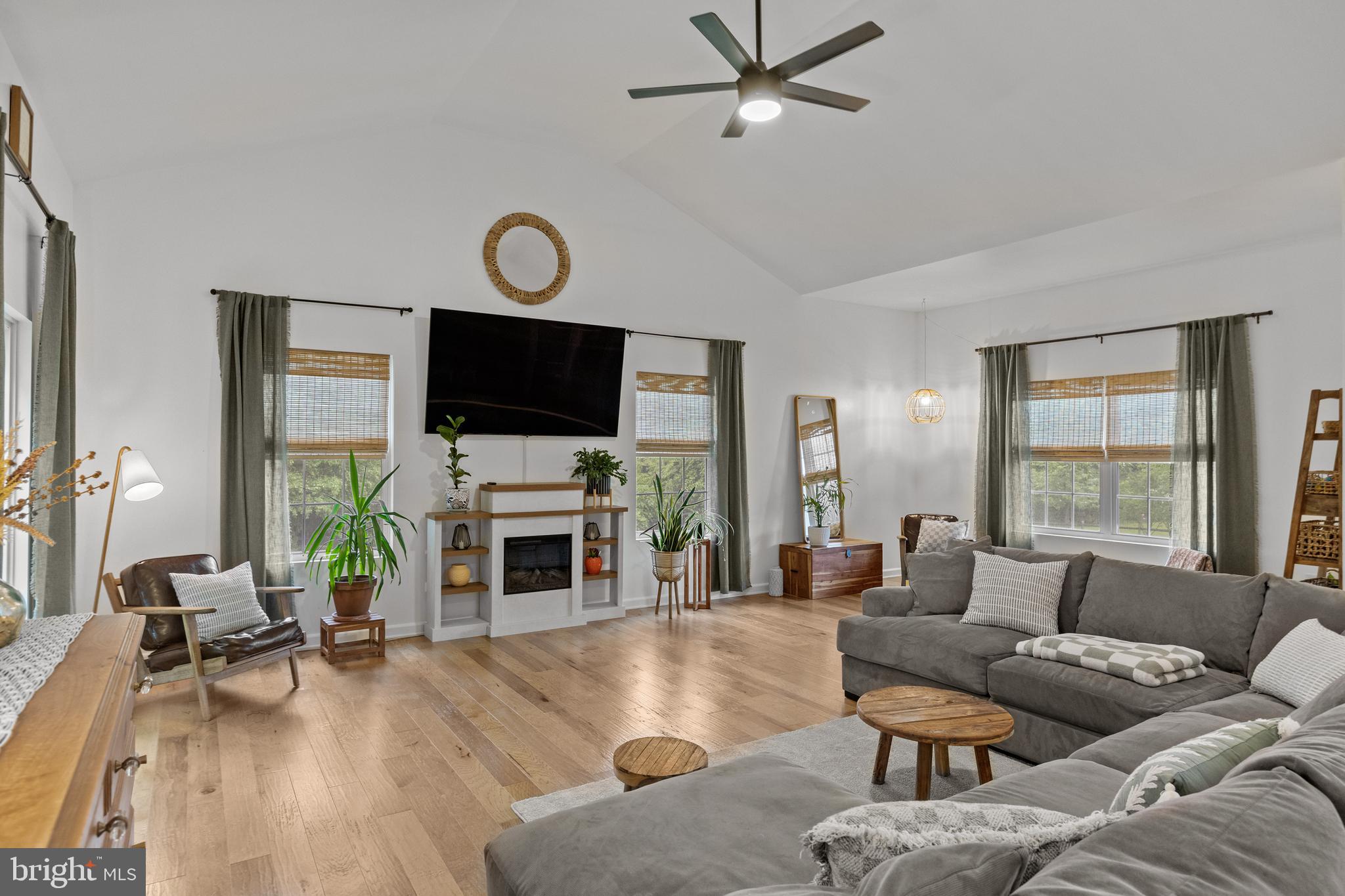 312 Juliustown Road Columbus, NJ 08022 - Photo 7 of 43 a living room with furniture a fireplace and a flat screen tv