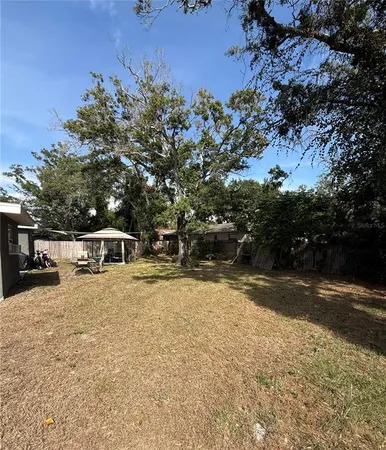 a swimming pool with trees in the background