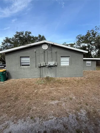 a backyard of a house with lots of green space
