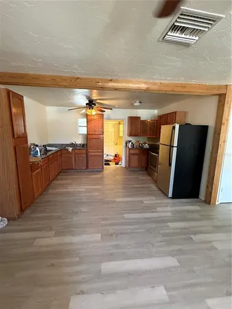 a view of a living room with furniture and a flat screen tv