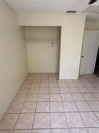 a view of a utility room and empty room