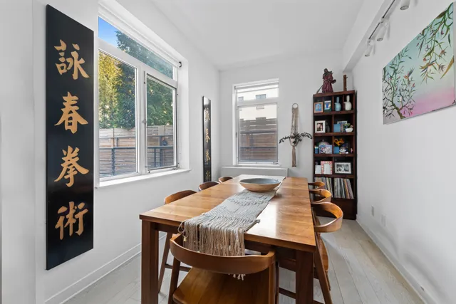 a view of a dining room with furniture and window