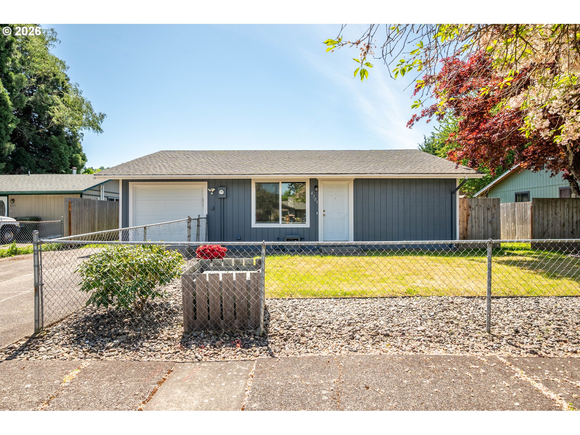4703 Merlin Street Longview, WA 98632 - Photo 1 of 25 a house view with a swimming pool