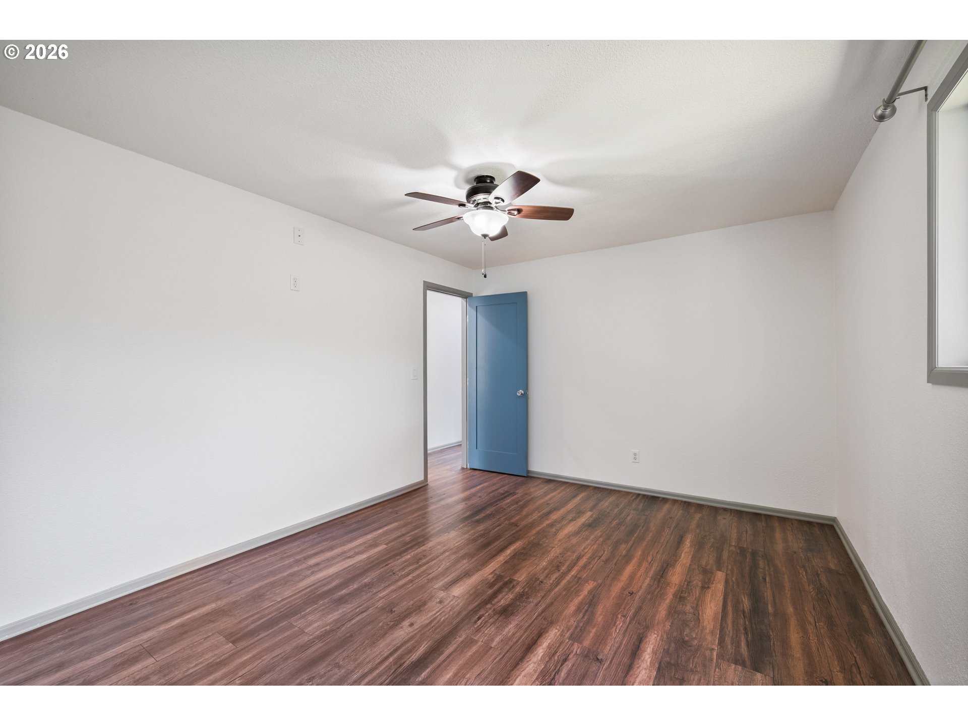 4703 Merlin Street Longview, WA 98632 - Photo 17 of 25 a view of an empty room with a ceiling fan
