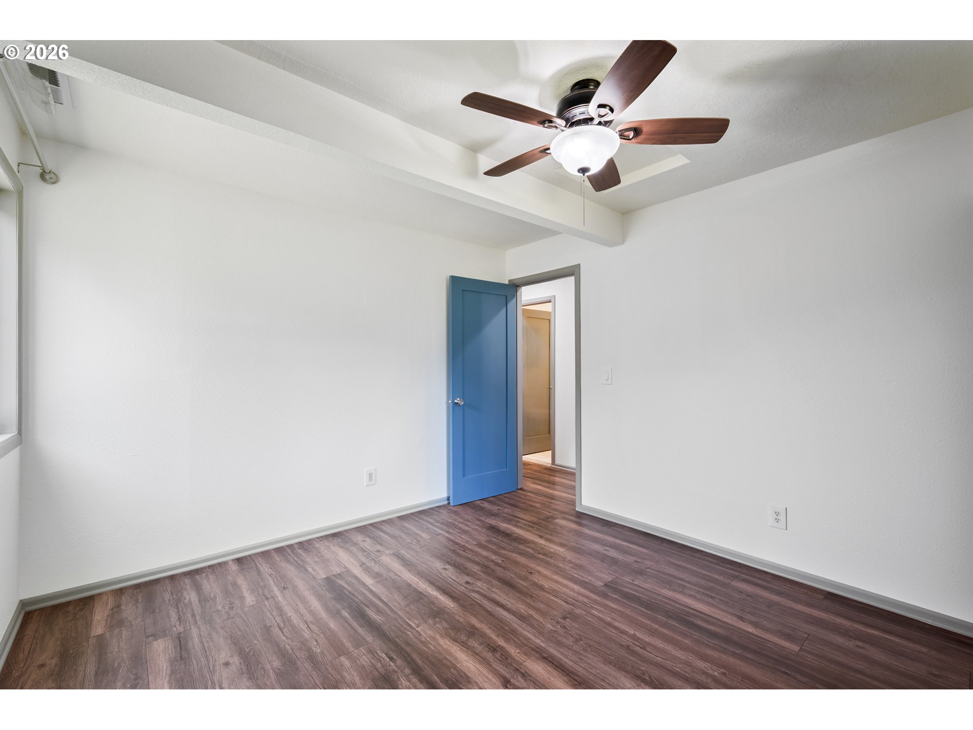 4703 Merlin Street Longview, WA 98632 - Photo 19 of 25 a view of an empty room with wooden floor