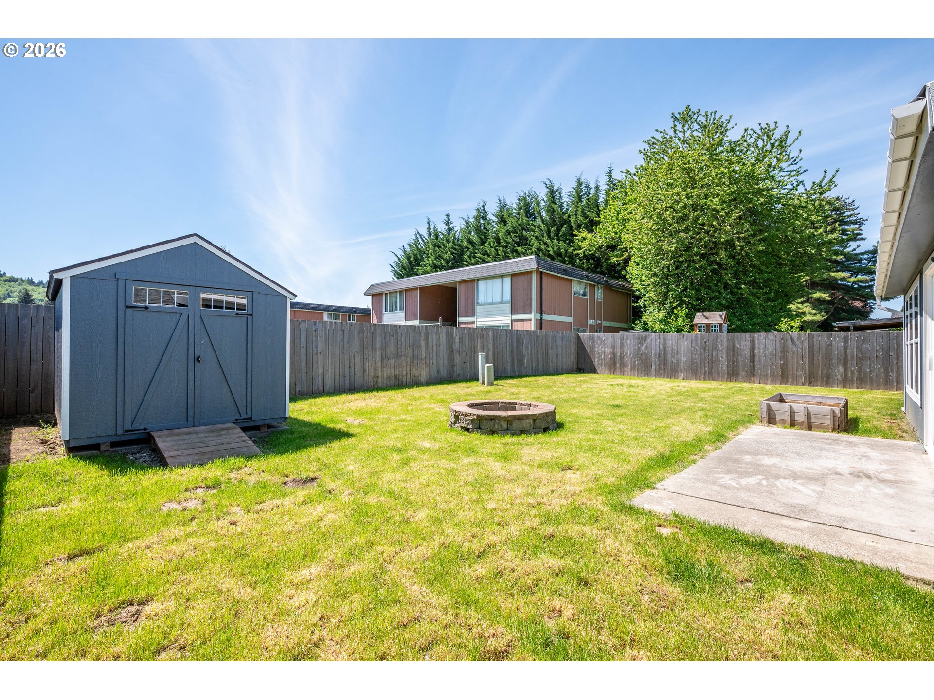 4703 Merlin Street Longview, WA 98632 - Photo 20 of 25 a swimming pool with wooden fence